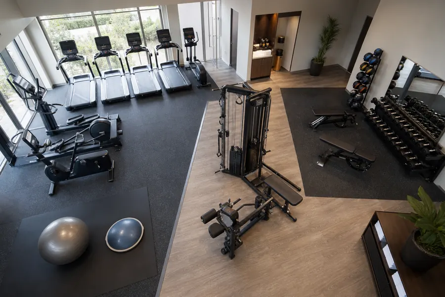 Hotel gym cardio strength free-weight and stretching zones
