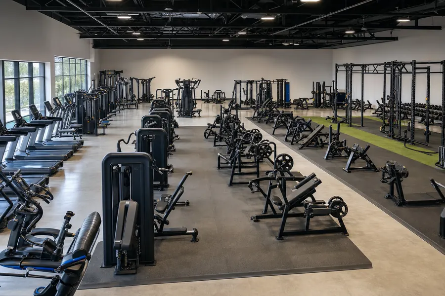 Commercial gym equipment portfolio arranged by category in a manufacturer showroom